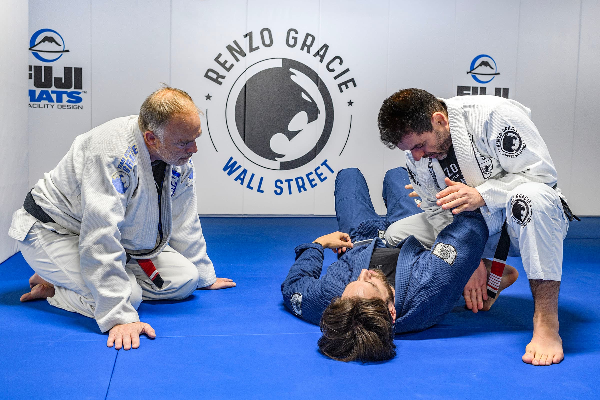 Black belt instructor demonstrating technique to a class at Renzo Gracie Jiu-Jitsu Wall Street